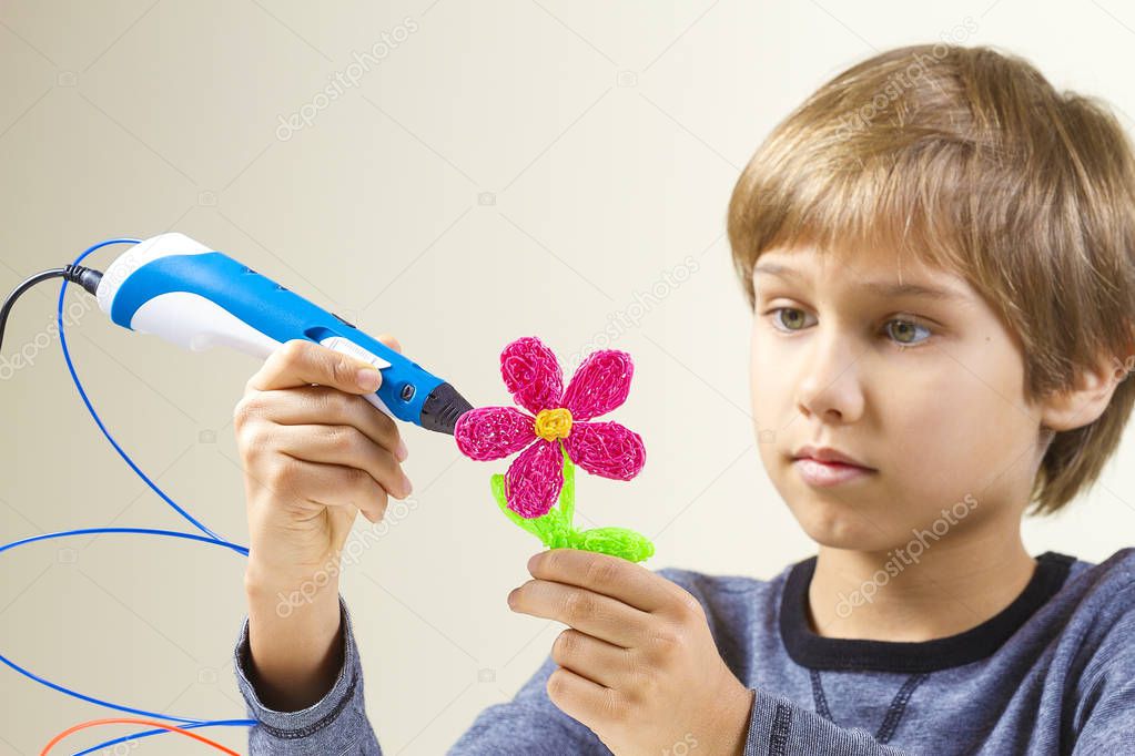 Child creating with 3D pen