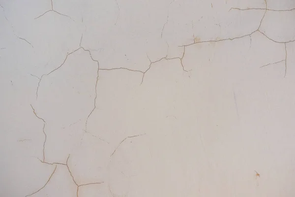 旧裂开的风沙斑斑剥皮墙背景. — 图库照片