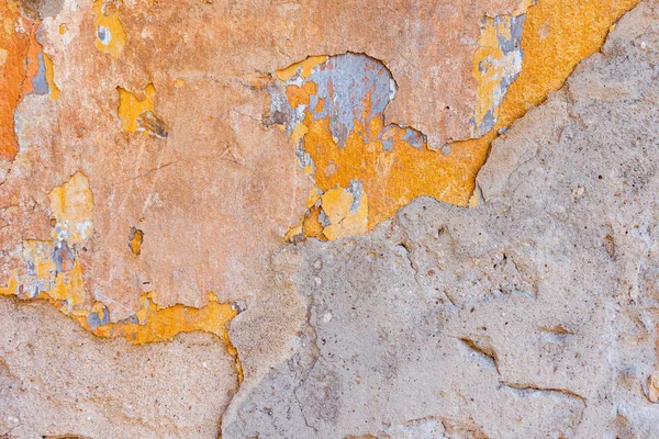 Antiguo agrietado resistido Shabby amarillo pintado yeso pelado fondo de pared . — Foto de Stock