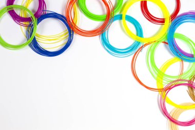 Colorful 3d pen filaments on white background, top view clipart