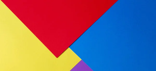 Sfondo di carta colorato con toni rossi, blu, viola e giallo — Foto Stock