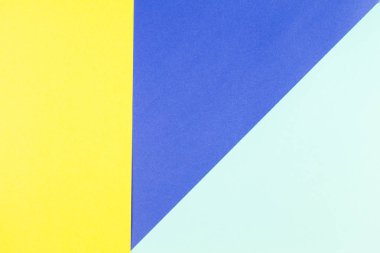Renkli kağıtları geometri düz kompozisyon arka plan sarı ve mavi tonları ile