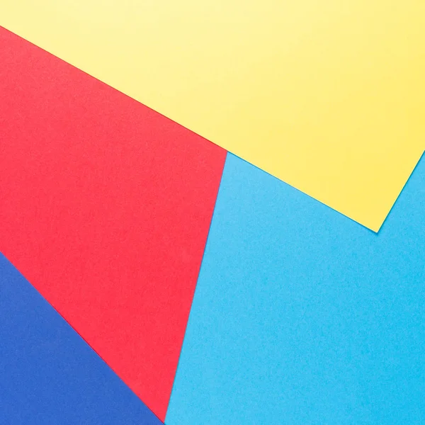 Geometria delle carte a colori sfondo composizione piatta con toni gialli, verdi, rossi e blu — Foto Stock
