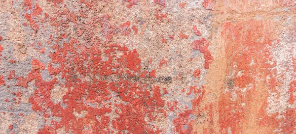 Eski yıpranmış duvar arkaplan dokusu. Kırmızı, kirli, alçıdan duvardan dökülen boya taneleri.. — Stok fotoğraf