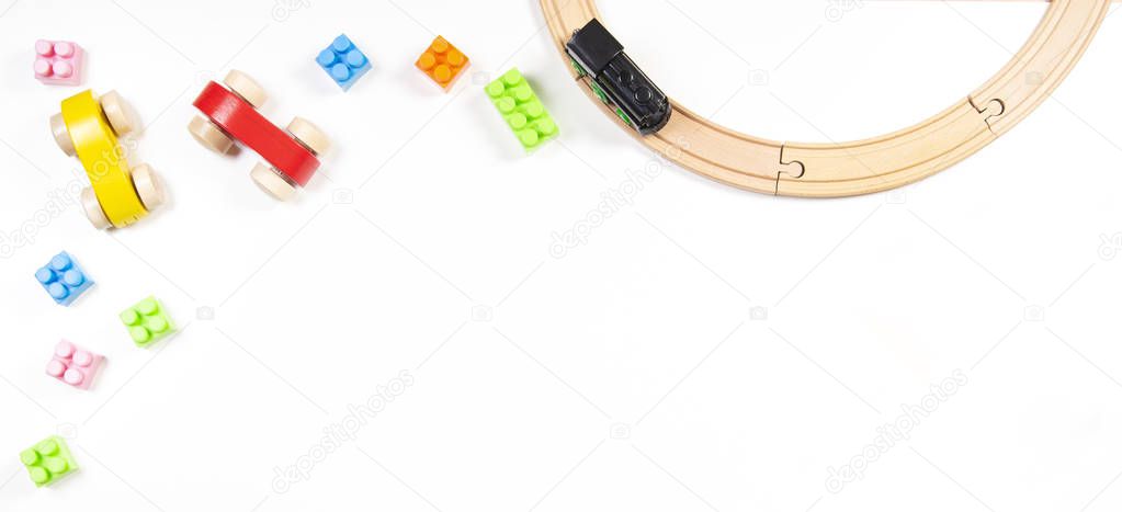 Colorful kids toys frame on white background. Top view. Flat lay.