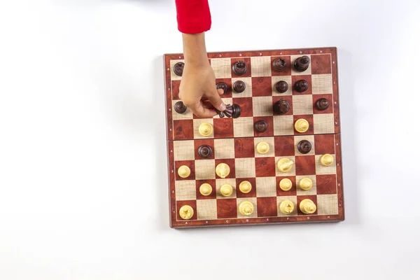 Kid hands over a chessboard playing chess game. Top view — Stock Photo, Image