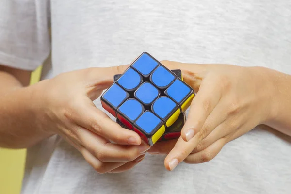 Vilnius, Lithuania - November 12, 2018: Kid playing with colorful magnetic cube — Stock Photo, Image