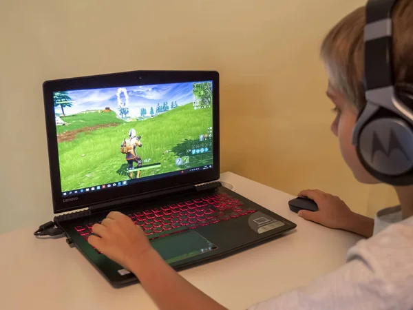 Vilnius, Lithuania - November 12, 2018: Boy playing Fortnite. Fortnite is online video game developed by Epic Games — Stock Photo, Image