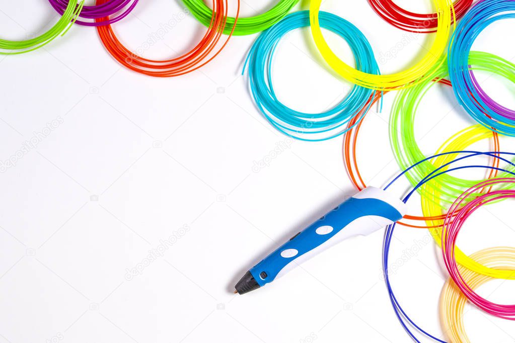 3d pen with colourful plastic filament on white background