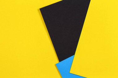 Geometrik düz sarı mavi ve siyah renk Kağıt arka plan yattı