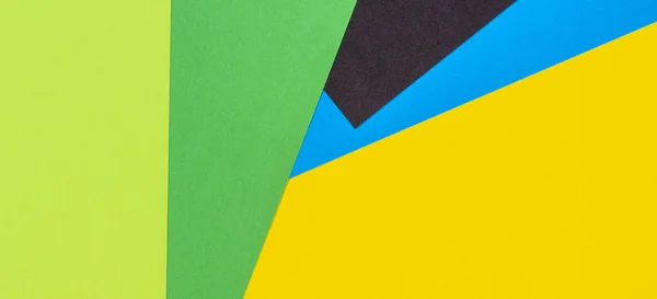 Geometrico piatto lay giallo verde blu e nero colore sfondo di carta — Foto Stock