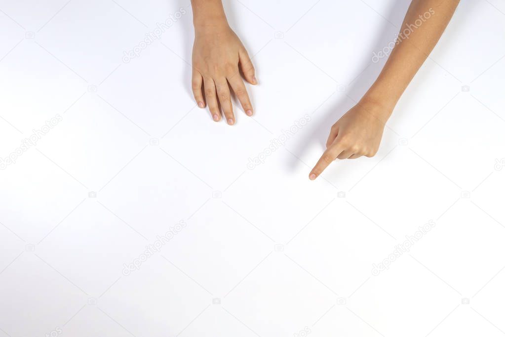 Children hands pointing on white background, top view
