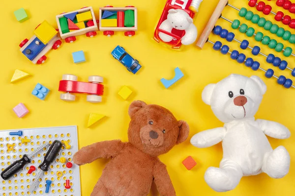 Kids toys on yellow background. Top view — Stock Photo, Image