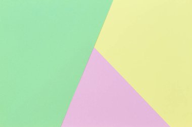 Soyut geometrik şekil pastel yeşil, pembe ve sarı renkli kağıt arka plan