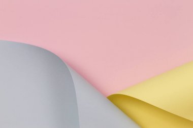 Soyut arka plan. Pastel pembe, sarı, geometrik şekillerde mavi renkli kağıt