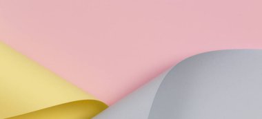 Soyut arka plan. Pastel pembe, sarı, geometrik şekillerde mavi renkli kağıt