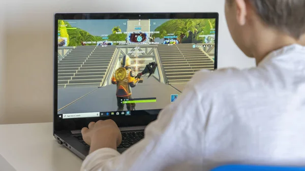 Vilnius, Lithuania - June 02, 2019: Boy playing Fortnite. Fortnite is online video game developed by Epic Games — Stock Photo, Image