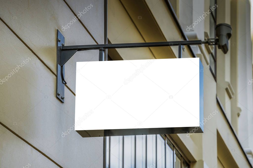 Mock up. Blank white signage on the wall of classical architecture building.