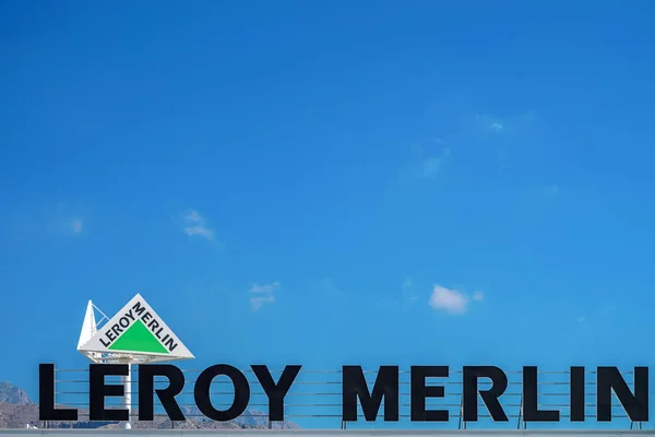 Finestrat, Spain, 18 June, 2019: Leroy Merlin brand sign and billboard against blue sky. French home-improvement, building tools, gardening retailer — Stock Photo, Image