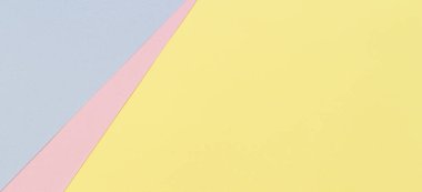 Soyut geometrik şekil pastel sarı, pembe ve mavi renkli kağıt arka plan