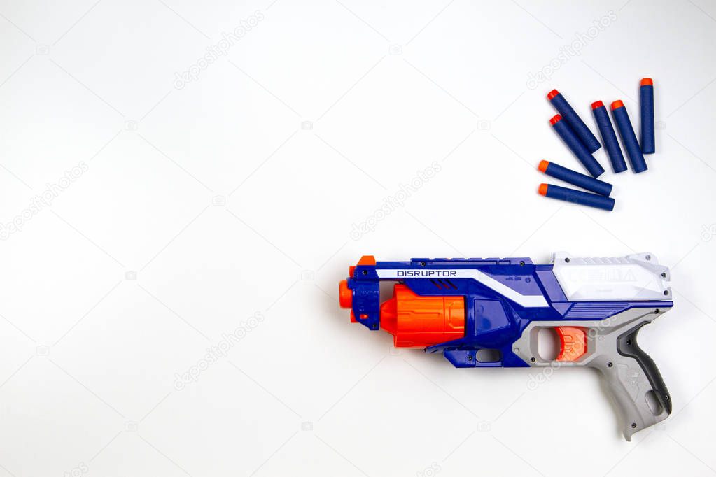 Vilnius, Lithuaania - March 5, 2019: Nerf N-Strike Elite Disruptor Blaster and Refill Bullet Darts on white background.