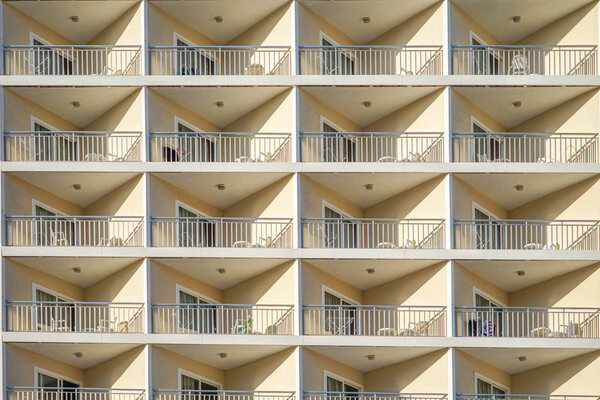 The pattern of balcony on the building exterior.