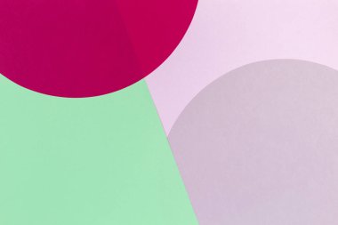 Soyut renkli kağıt arka plan. Pastel pembe, kırmızı ve açık yeşil renk yuvarlak daire şekil geometri kompozisyonu. Üstte görüntü