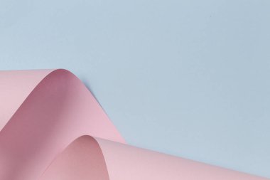 Soyut geometrik şekil pastel pembe ve mavi renkli kağıt arka plan