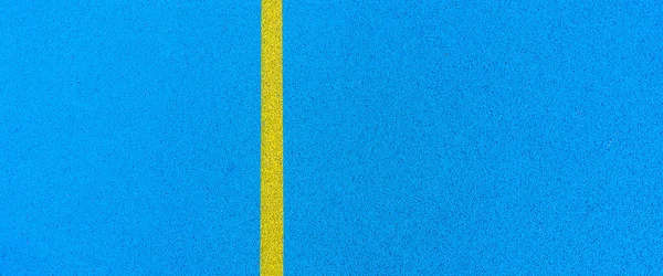 Colorful sports court banner background. Top view blue field rubber ground with white line outdoors