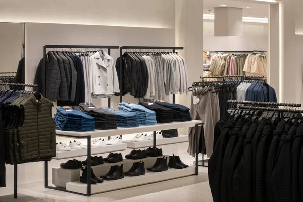 Empty modern fashionable brand interior of clothing store inside shopping center — Stock Photo, Image