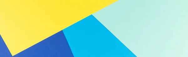 Χρώμα χαρτιού γεωμετρία επίπεδη σύνθεση φόντο με κίτρινο και μπλε τόνους — Φωτογραφία Αρχείου