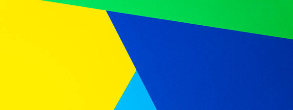 Abstract geometric shape yellow, blue, green color paper background