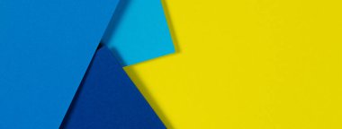 Soyut renk kağıtları geometri düz kompozisyon arka planı mavi ve sarı tonlarla