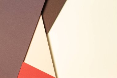 Toprak tonlarında soyut geometrik kağıt arka plan. Bej, sarı, mercan, kahverengi arkaplan