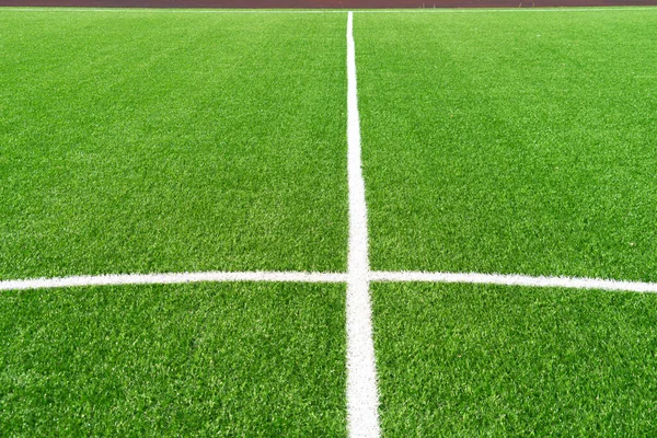 Verde erba artificiale tappeto erboso campo di calcio sfondo con linee bianche. Vista dall'alto — Foto Stock