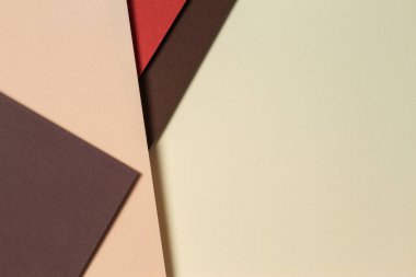 Toprak tonlarında soyut geometrik kağıt arka plan. Bej, sarı, mercan, kahverengi arkaplan