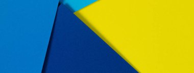 Soyut renk kağıtları geometri düz kompozisyon arka planı mavi ve sarı tonlarla