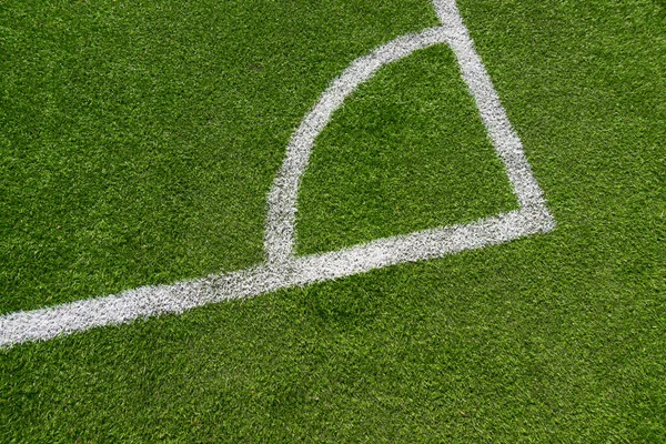 Green artificial grass turf soccer football field background with white line boundary. Top view