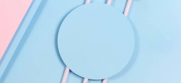 Abstract pastel background. Mockup of blue paper card on pastel blue and pink background. Minimal geometric shapes and lines, top view