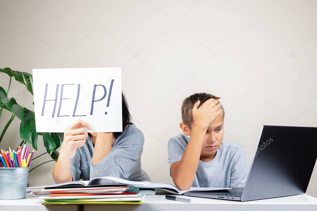 Learning difficulties, remote education, online learning and working at home. Tired mother and sad kid need help to do homework