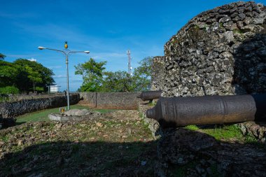 The Historic Cannons of the Buton Palace Fort Overlooking the Modern City View, Capturing the Contrast of Time clipart