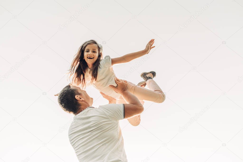 Happy Father and Daughter Having Fun, Enjoying Sunny Summer
