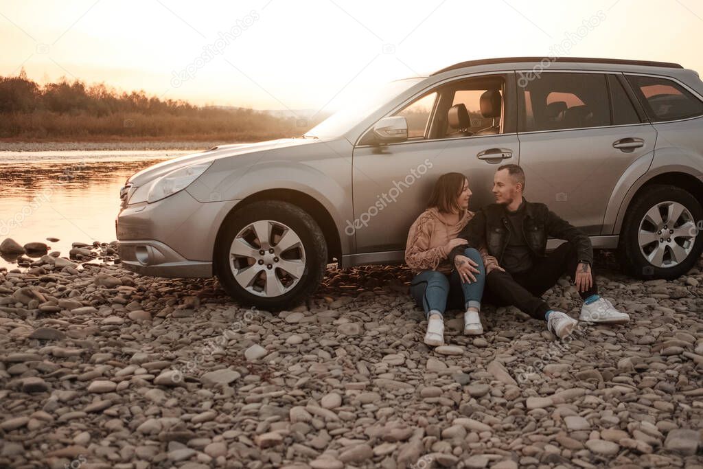 Young Couple Travel with a Car and Enjoys Ride, Weekend and Adventure Concept