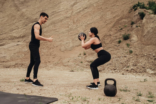 Two Athletes in Black Sportswear Training Together Open Air Healthy Lifestyle and Outdoors Workout Concept