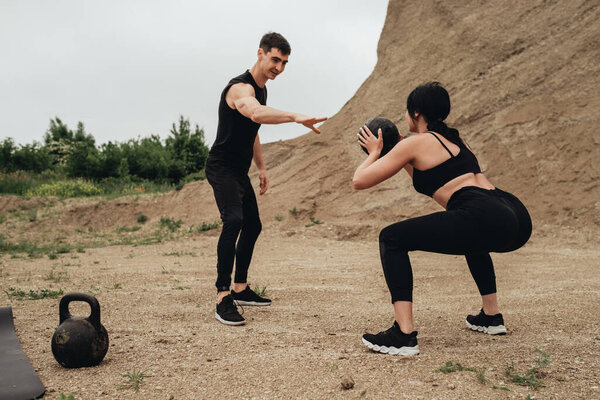 Two Athletes in Black Sportswear Training Together Open Air Healthy Lifestyle and Outdoors Workout Concept
