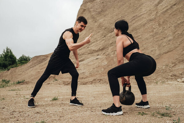 Two Athletes in Black Sportswear Training Together Open Air Healthy Lifestyle and Outdoors Workout Concept