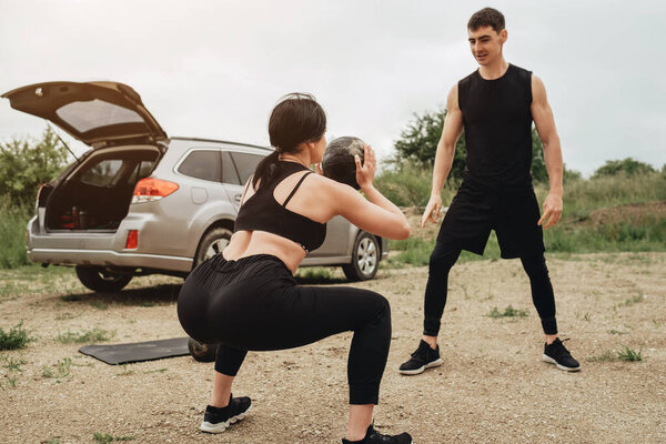 Two Athletes in Black Sportswear Training Together Open Air Healthy Lifestyle and Outdoors Workout Concept