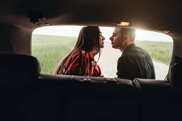 View Through Car Trunk, Young Beautiful Couple Enjoying Roadtrip, Romantic Mood