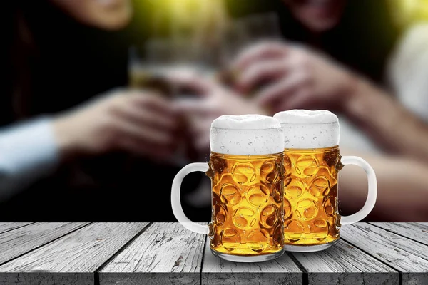 cold glass with beer with people background