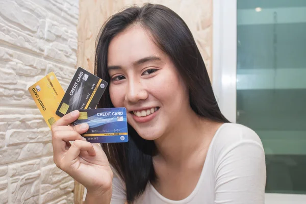 Asia woman show plastic credit card